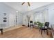 Living room with hardwood floors, bay window, and ceiling fan at 111 Herring Way, Kissimmee, FL 34759