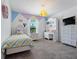 Charming bedroom with playful decor and built-in shelving at 4743 Magnetite Loop, Mount Dora, FL 32757