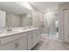 Double vanity bathroom with a large walk-in shower at 4743 Magnetite Loop, Mount Dora, FL 32757