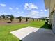 Large backyard with a patio and beautiful landscaping at 4743 Magnetite Loop, Mount Dora, FL 32757