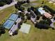 Aerial view showing tennis courts, basketball court, pool, and community clubhouse at 4743 Magnetite Loop, Mount Dora, FL 32757