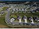 Aerial view of a community with many houses at 4743 Magnetite Loop, Mount Dora, FL 32757