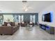 Open living area with comfortable seating and a modern aesthetic at 4743 Magnetite Loop, Mount Dora, FL 32757