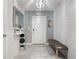 Bright entryway with a bench, mirror, and decor at 4743 Magnetite Loop, Mount Dora, FL 32757