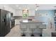 Modern kitchen with island and stainless steel appliances at 4743 Magnetite Loop, Mount Dora, FL 32757