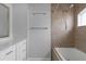 Bathroom with shower/tub combo, updated tile, and modern fixtures at 3570 Manor Loop, Lakeland, FL 33810