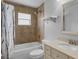 Updated bathroom with tub, shower, and vanity at 3570 Manor Loop, Lakeland, FL 33810