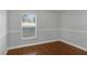 Cozy bedroom with wood floors and window with blinds at 3570 Manor Loop, Lakeland, FL 33810