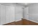 Bedroom with double doors closet and wood flooring at 3570 Manor Loop, Lakeland, FL 33810