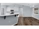 Modern kitchen with white cabinets and a breakfast bar at 3570 Manor Loop, Lakeland, FL 33810