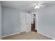 Bright bedroom with double doors and ceiling fan at 3570 Manor Loop, Lakeland, FL 33810