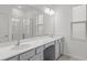 Modern bathroom with double vanity and a large mirror at 5773 High Seas Dr, Orlando, FL 32821