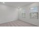 Well-lit bedroom with gray carpeting and two windows at 5773 High Seas Dr, Orlando, FL 32821