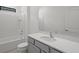 Bathroom with shower/tub combo and gray vanity at 5773 High Seas Dr, Orlando, FL 32821