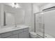Bathroom with walk-in shower and gray vanity at 5773 High Seas Dr, Orlando, FL 32821