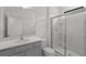 Bathroom with walk-in shower and gray vanity at 5773 High Seas Dr, Orlando, FL 32821