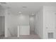 Upstairs hallway with carpeted flooring and access to bedrooms at 5773 High Seas Dr, Orlando, FL 32821