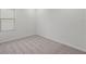 Bright bedroom with gray carpet and window at 5773 High Seas Dr, Orlando, FL 32821