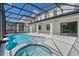 Inviting pool and spa with screened enclosure at 5773 High Seas Dr, Orlando, FL 32821