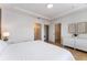 Bedroom with a queen-size bed and access to a walk-in closet at 4683 Terrasonesta Dr, Davenport, FL 33837