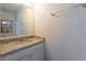 Small bathroom with granite countertop and single sink vanity at 4683 Terrasonesta Dr, Davenport, FL 33837