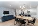 Open concept dining area with kitchen and living room views at 4683 Terrasonesta Dr, Davenport, FL 33837