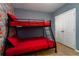 Bedroom with bunk beds and a cartoon-themed wall at 4683 Terrasonesta Dr, Davenport, FL 33837
