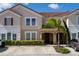 Townhouse exterior with parking and landscaping at 4683 Terrasonesta Dr, Davenport, FL 33837