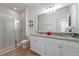 Bathroom with granite countertop double vanity and shower at 4683 Terrasonesta Dr, Davenport, FL 33837