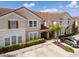 Townhouse with tile roof and landscaping at 4683 Terrasonesta Dr, Davenport, FL 33837