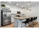 Modern kitchen with island and stainless steel appliances at 4683 Terrasonesta Dr, Davenport, FL 33837