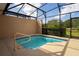 Small, screened-in pool with a handrail at 4683 Terrasonesta Dr, Davenport, FL 33837
