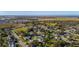 Aerial view of neighborhood with various houses and landscape at 1402 Westminster Way, Kissimmee, FL 34744