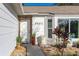 Front entrance with potted plants and stone accents at 1402 Westminster Way, Kissimmee, FL 34744