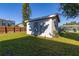 White storage shed in sunny backyard at 1402 Westminster Way, Kissimmee, FL 34744