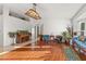 Living room with hardwood floors, piano, and ample natural light at 1402 Westminster Way, Kissimmee, FL 34744