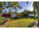 Backyard view with shed and large lawn area at 1402 Westminster Way, Kissimmee, FL 34744