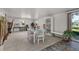 Bright Florida room with whitewashed table and chairs at 1402 Westminster Way, Kissimmee, FL 34744