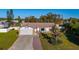 House exterior with a brick walkway leading to the garage at 1402 Westminster Way, Kissimmee, FL 34744