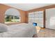 Bedroom with a full bed and built-in shelving unit at 1402 Westminster Way, Kissimmee, FL 34744