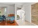 Bright entryway with wood accent wall, tile floor, and bench seating at 1402 Westminster Way, Kissimmee, FL 34744