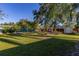 Spacious backyard with a shed and well-manicured lawn at 1402 Westminster Way, Kissimmee, FL 34744