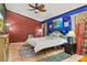 Main bedroom with a king-size bed and artistic wall decor at 1402 Westminster Way, Kissimmee, FL 34744