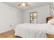 Small bedroom with tiled floor and window access at 1402 Westminster Way, Kissimmee, FL 34744
