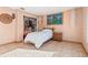 Bedroom with a twin bed, large window, and built-in shelving at 1402 Westminster Way, Kissimmee, FL 34744