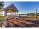 Relaxing lakefront pavilion with picnic tables and scenic views at 1402 Westminster Way, Kissimmee, FL 34744