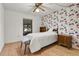Small bedroom with floral wallpaper and a single bed at 1402 Westminster Way, Kissimmee, FL 34744
