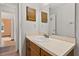 Clean bathroom with single sink vanity and mirror at 1402 Westminster Way, Kissimmee, FL 34744