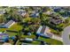 Aerial view of property showing house, yard, and neighboring homes at 1402 Westminster Way, Kissimmee, FL 34744