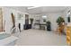 Spacious Florida room, featuring a desk and seating area at 1402 Westminster Way, Kissimmee, FL 34744